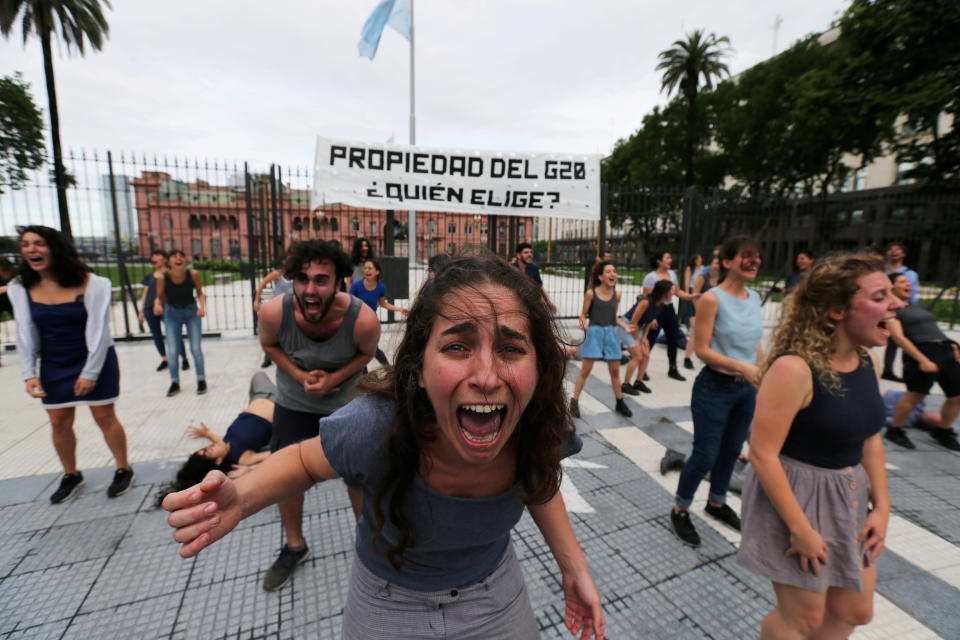 Demonstrators perform outside the presidential palace ahead of the Group 20 summit, in Buenos Aires, Argentina, on Thursday. The writing on the banner reads: “Property of the G20, who chooses?” (Photo: Sergio Moraes/Reuters)