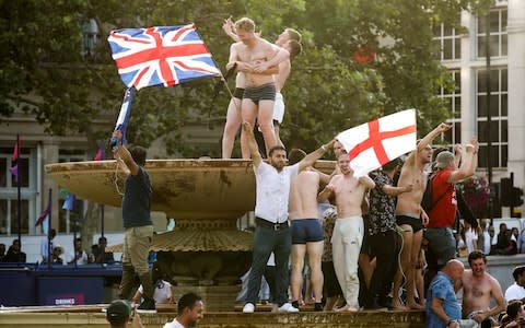 Some England fans celebrated by taking a dip in the fountains - Credit: Chris Radburn/PA