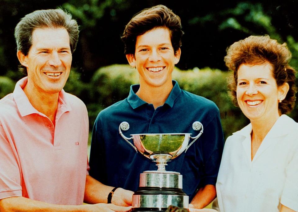 Tim Henman aged 18 with the British Junior Champion Trophy, flanked by his parents