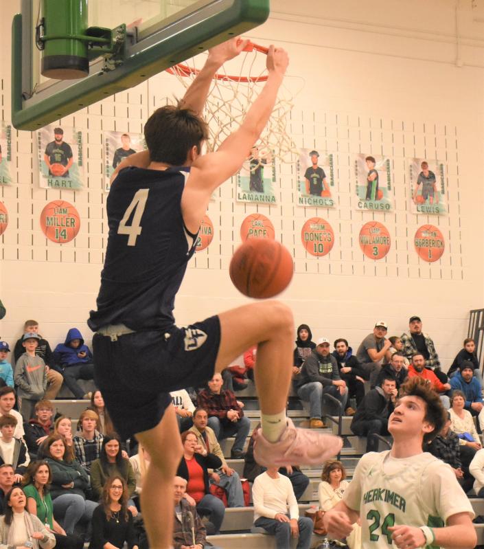 Coltan Frederick (4) dunks for Little Falls in the final minute of a 47-45 win over the Herkimer Magicians Friday.