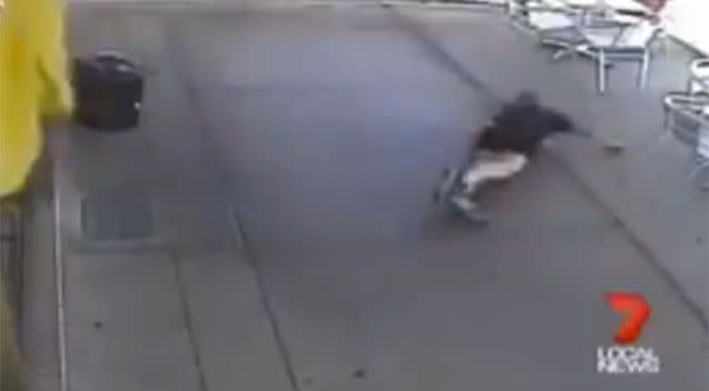 The woman is left on the footpath after the shocking attack. Source: 7 News.