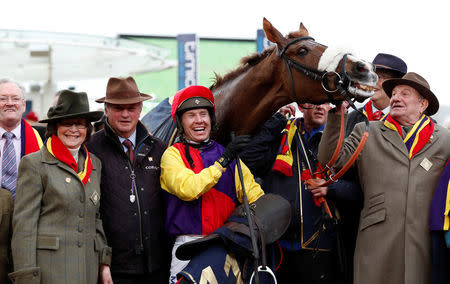 Horse Racing - Cheltenham Festival - Cheltenham Racecourse, Cheltenham, Britain - March 16, 2018 Richard Johnson on Native River celebrates with the team after winning the 15.30 Timico Cheltenham Gold Cup Chase Action Images via Reuters/Andrew Boyers