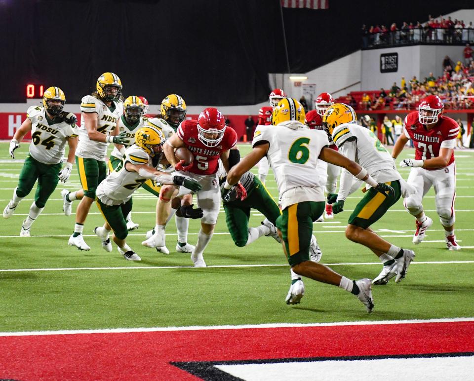 South Dakota’s Travis Theis pushes toward the end zone during a game against North Dakota State on Saturday, September 24, 2022, at the DakotaDome in Vermillion.