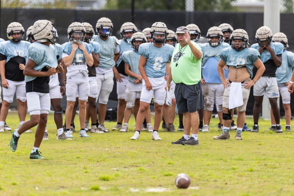 North Bay Haven hit the practice field this week preparing for their fall season. John Pate,new coach for the Buccaneers, talks with his team at practice Tuesday.