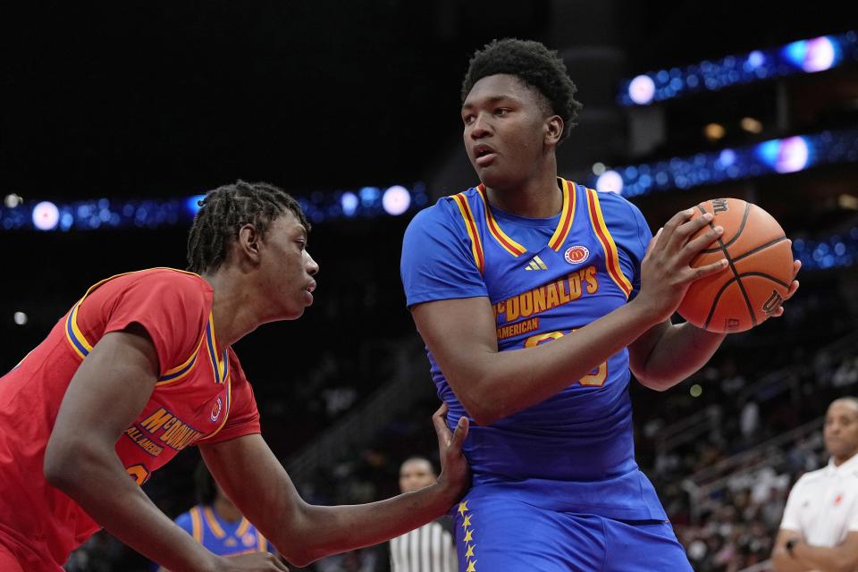 East center Derik Queen (25) is defended by West center Aiden Sherrell, left, during the third quarter of the McDonald's All-American boys' basketball game Tuesday, April 2, 2024, in Houston. (AP Photo/Kevin M. Cox)