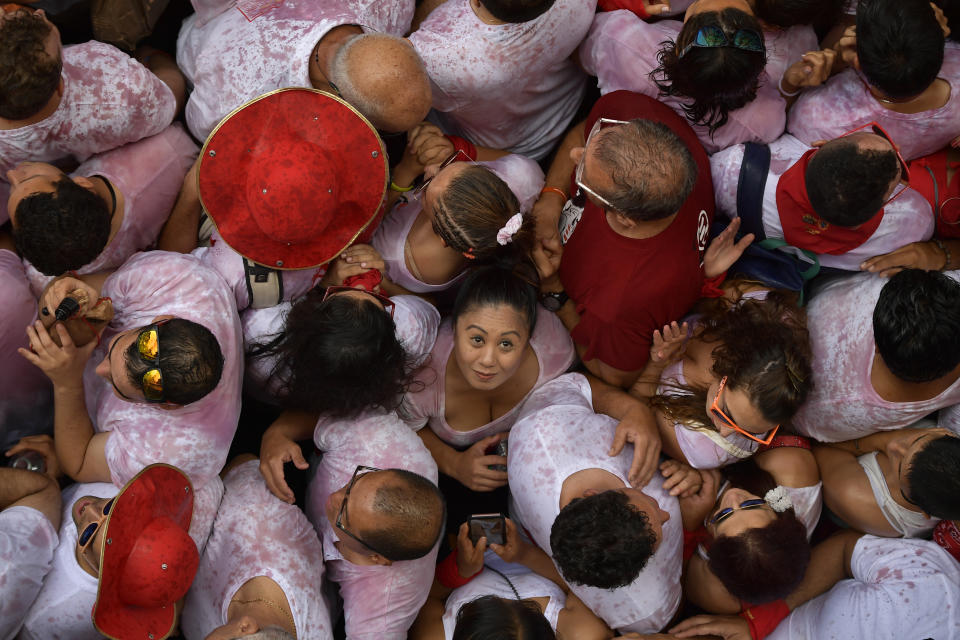 <p>Revellers pack the main square during the launch of the ‘Chupinazo’ rocket, to celebrate the official opening of the 2018 San Fermin fiestas with daily bull runs, bullfights, music and dancing in Pamplona, Spain, Friday July 6, 2018. (Photo: Alvaro Barrientos/AP) </p>