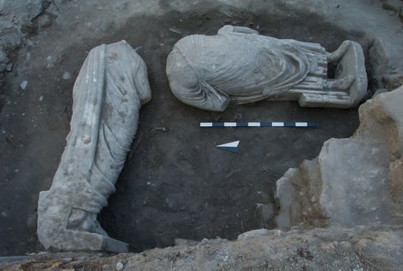 Two headless Roman-era statues were recycled by medieval builders as foundation material. (Photo courtesy of R.R.R. Smith)