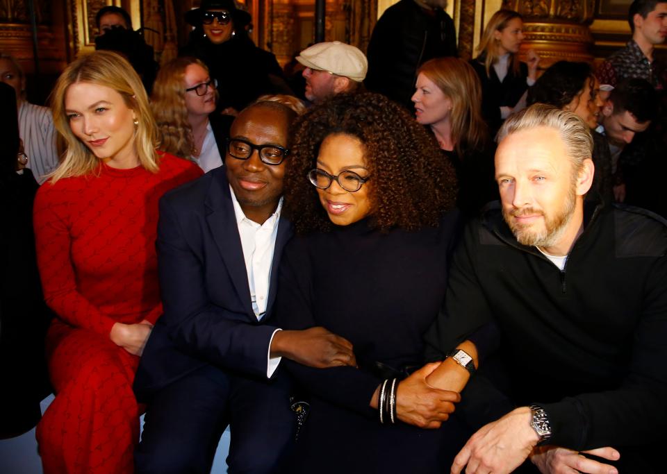 Model Karlie Kloos, left, and British Vogue magazine chief editor Edward Enninful, second left, and Oprah Winfrey at a 2019 Paris fashion show,