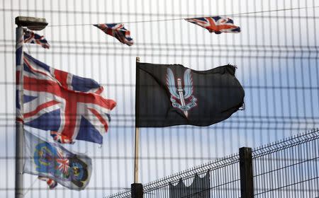 A flag bearing the emblem of the Special Air Services (SAS) flies in the Loyalist Tigers Bay area of North Belfast August 19, 2014. REUTERS/Cathal McNaughton