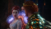 This image released by Warner Bros. Pictures shows Amber Heard, left and Dolph Lundgren in a scene from "Aquaman." (Jasin Boland/Warner Bros. Pictures via AP)