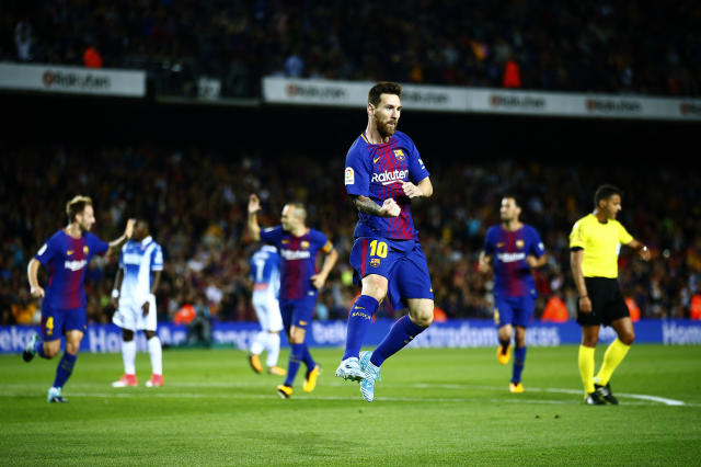 Lionel Messi (foreground) and Barcelona sure didn’t look troubled in a 5-0 win over rival Espanyol. (AP)