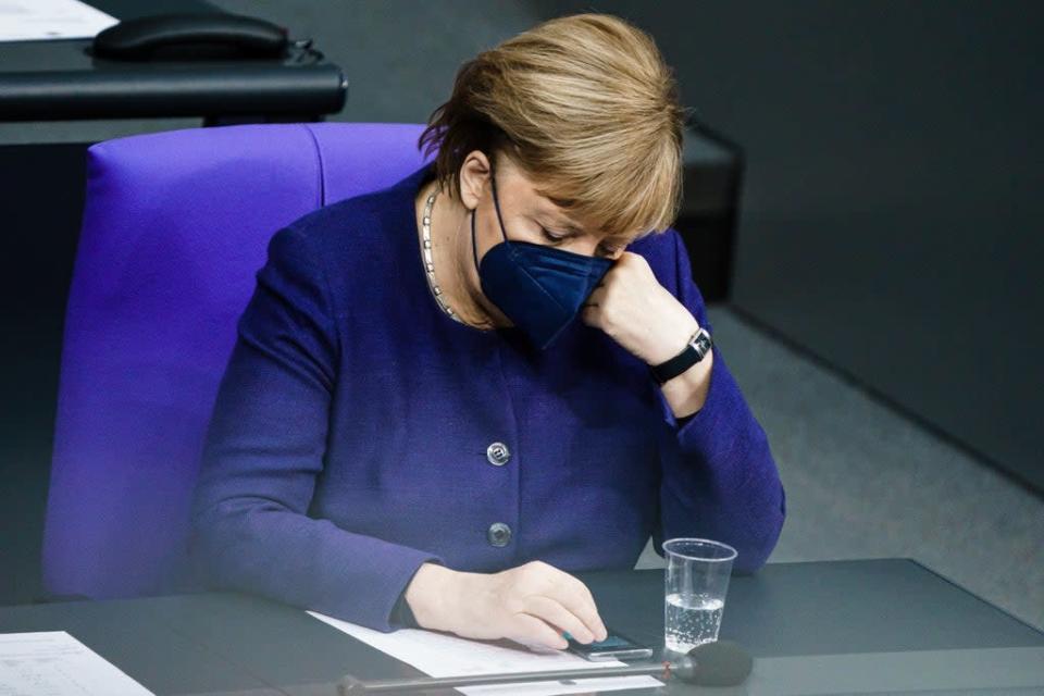  German chancellor Angela Merkel during the latest Bundestag session on coronavirus restrictions (EPA)