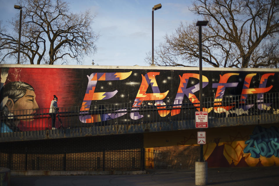 A mural stands at the entrance to a pedestrian bridge in Little Earth, a housing complex for Natives in Minneapolis, Monday, Nov. 15, 2021. Historic disinvestment in Native communities by the federal government left many already living on the brink of poverty. Then the pandemic pushed many toward addiction, called a “disease of despair.” Unemployment in Indian County surged to 26%. (AP Photo/David Goldman)