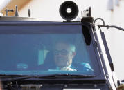 Australian Prime Minister Malcolm Turnbull rides in a Bushmaster military vehicle at Narashino exercise field in Funabashi, east of Tokyo, Japan January 18, 2018. REUTERS/Kim Kyung-Hoon