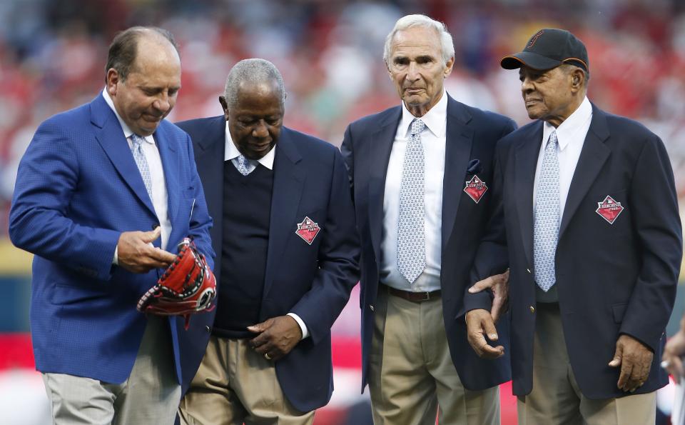 From left: Johnny Bench, Hank Aaron, Sandy Koufax and Willie Mays walk off the field after being honored as the greatest living baseball players prior to the 2015 MLB All-Star Game, Tuesday, July 14, 2015, at Great American Ball Park in Cincinnati.

071415 All Star Game