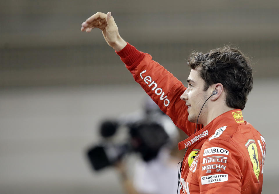 Ferrari driver Charles Leclerc of Monaco celebrates his pole position after the qualifying session at the Formula One Bahrain International Circuit in Sakhir, Bahrain, Saturday, March 30, 2019. The Bahrain Formula One Grand Prix will take place on Sunday. (AP Photo/Luca Bruno)