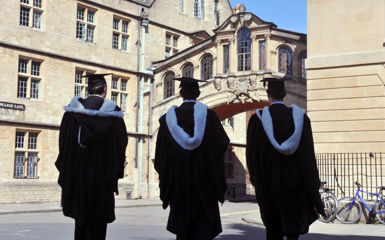 Graduates in traditional robes at Oxford University - Getty Images Contributor