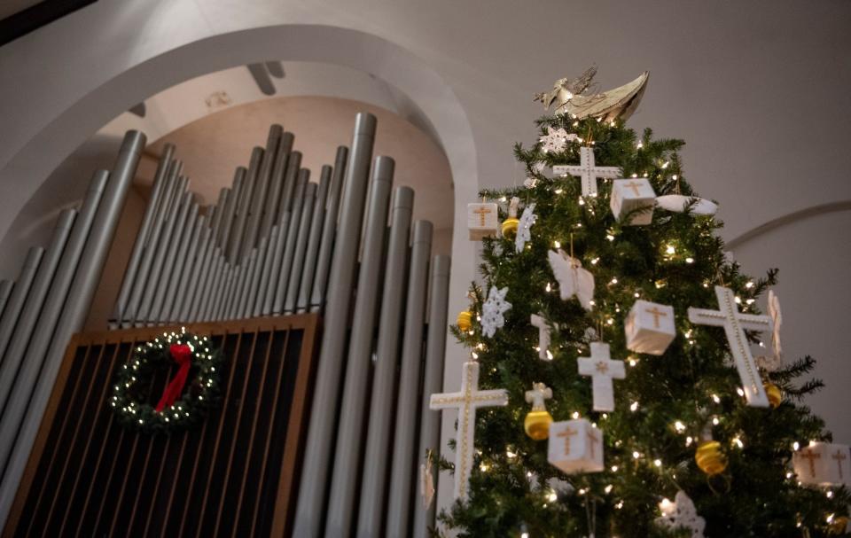 A tree full of ornaments made by the congregation is shown in the sanctuary of the Bellefonte First Presbyterian Church on Dec. 22. 2021 in Bellefonte, Pa. The church which is nearly as old as the borough itself, held the final scheduled service on Christmas Eve after having welcomed generations of families over the course of more than two centuries. (Abby Drey/Centre Daily Times via AP)