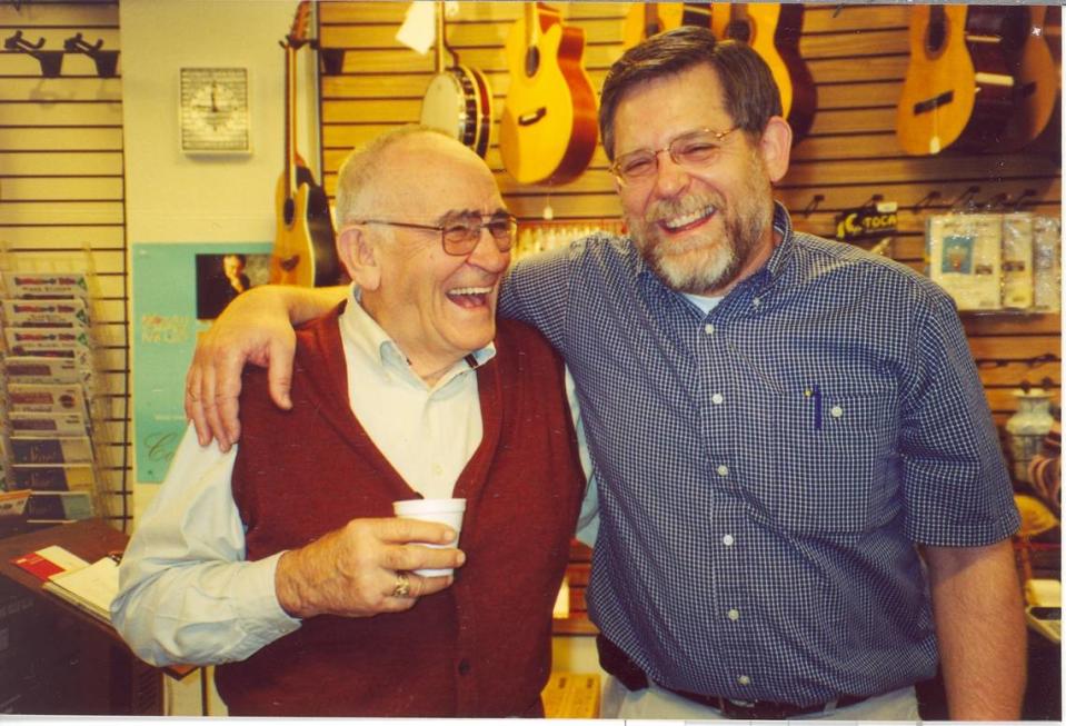 PJ Winther, left, and son Greg Winther at Winther Music in 2001.