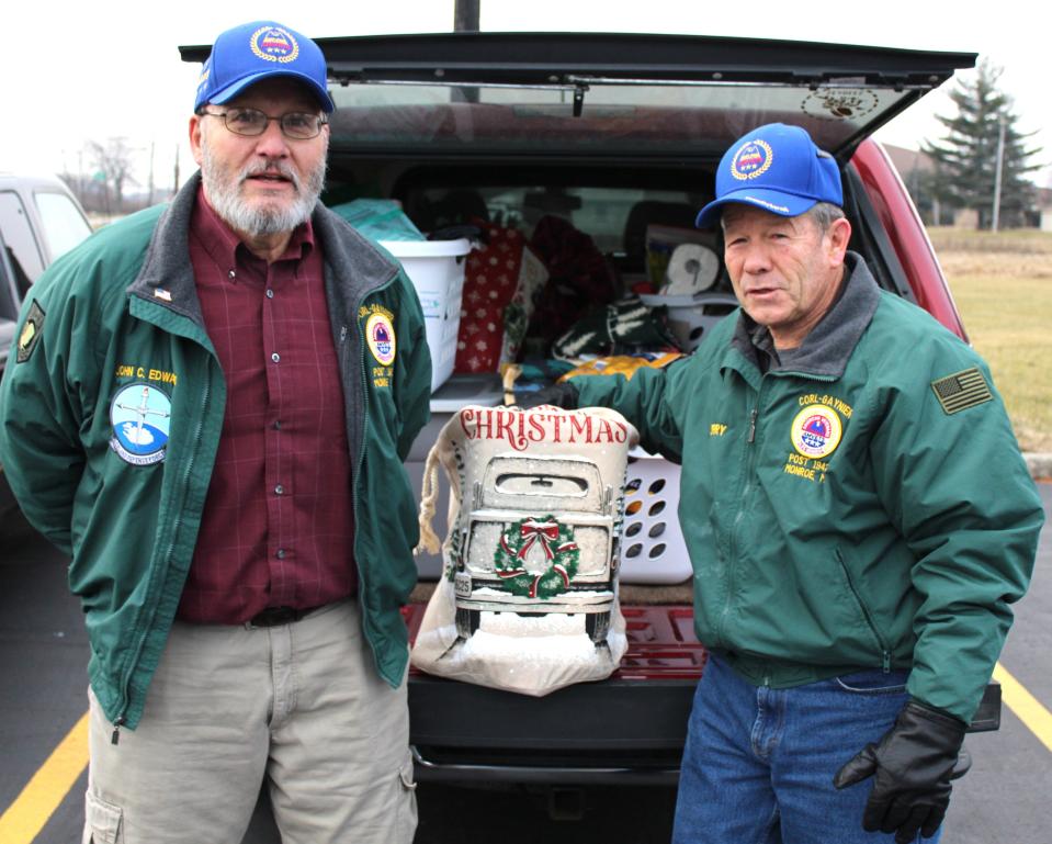 Days before Christmas, Monroe Township residents and veterans  John Edwards, left,  and Jerry Heck volunteered to help with Angels 4 Vets deliveries.