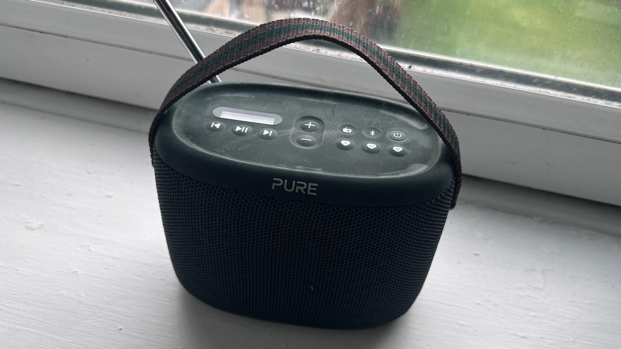  The Pure Woodland Bluetooth speaker and DAB radio sat on a window sill. 