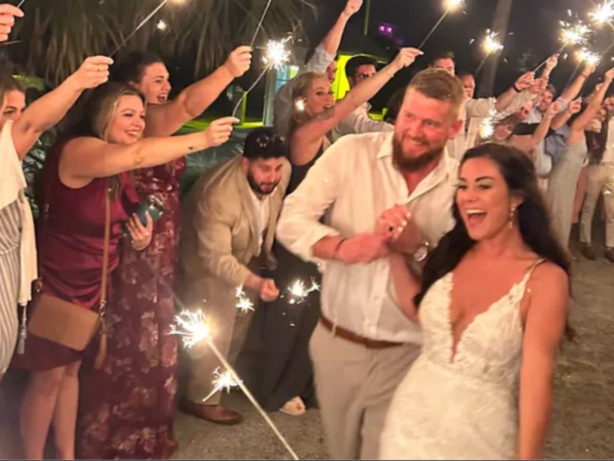Aric Hutchinson and Samantha Miller at their wedding moments before the crash (screengrab/GoFundMe)