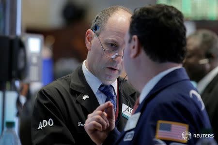 Traders work on the floor of the New York Stock Exchange (NYSE) in New York City, U.S., May 25, 2016. REUTERS/Brendan McDermid