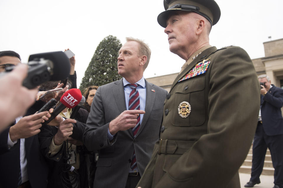 Acting Secretary of Defense Patrick Shanahan, center, and Chairman of the Joint Chiefs Gen. Joseph Dunford, right, talk to the press before the arrival of Turkish Defense Minister Hulusi Akar on Friday, Feb. 22, 2019 at the Pentagon in Washington. (AP Photo/Kevin Wolf)