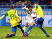 Football Soccer - Mamelodi Sundown v Kashima Antlers - FIFA Club World Cup Match 3 - Suita City Football Stadium, Suita, Osaka Prefecture, Japan - 11/12/16. Mamelodi Sundown's Samuel Mabunda, Ricardo Nascimento and Kashima Antlers' Shoma Doi in action. REUTERS/Toru Hanai