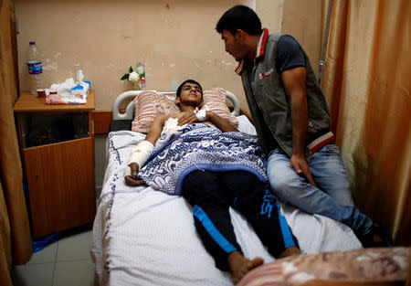 An injured Palestinian lies on a bed at a hospital in Gaza City May 15, 2018. REUTERS/Mohammed Salem
