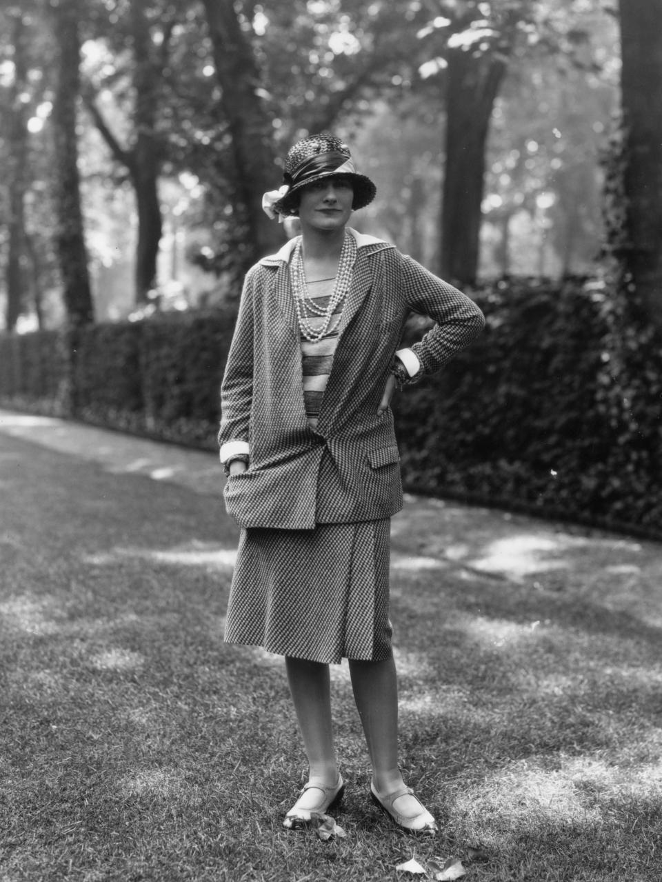 Coco Chanel modelling a Chanel suit at Fauborg, St Honore, Paris in 1929.Getty Images