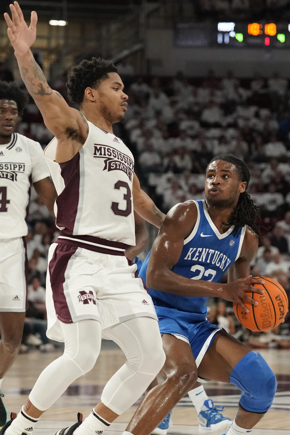 Kentucky guard Cason Wallace (22) pulls up as Mississippi State guard Shakeel Moore (3) defends during the first half of an NCAA college basketball game in Starkville, Miss., Wednesday, Feb. 15, 2023. (AP Photo/Rogelio V. Solis)