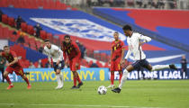England's Marcus Rashford scores his side's first goal from the penalty spot during the UEFA Nations League soccer match between England and Belgium at Wembley stadium in London, Sunday, Oct. 11, 2020. (Michael Regan/Pool via AP)