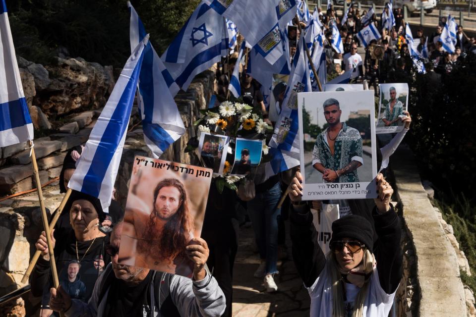 Mourners carried photos of victims killed during the Oct. 7 deadly Hamas attack on Israel's south during a memorial event held in February by families of victims in Jerusalem, Israel. As Israel examined the details of a fresh truce agreement with Hamas, pressure mounted on the Netanyahu government over its handling of events since the attack.