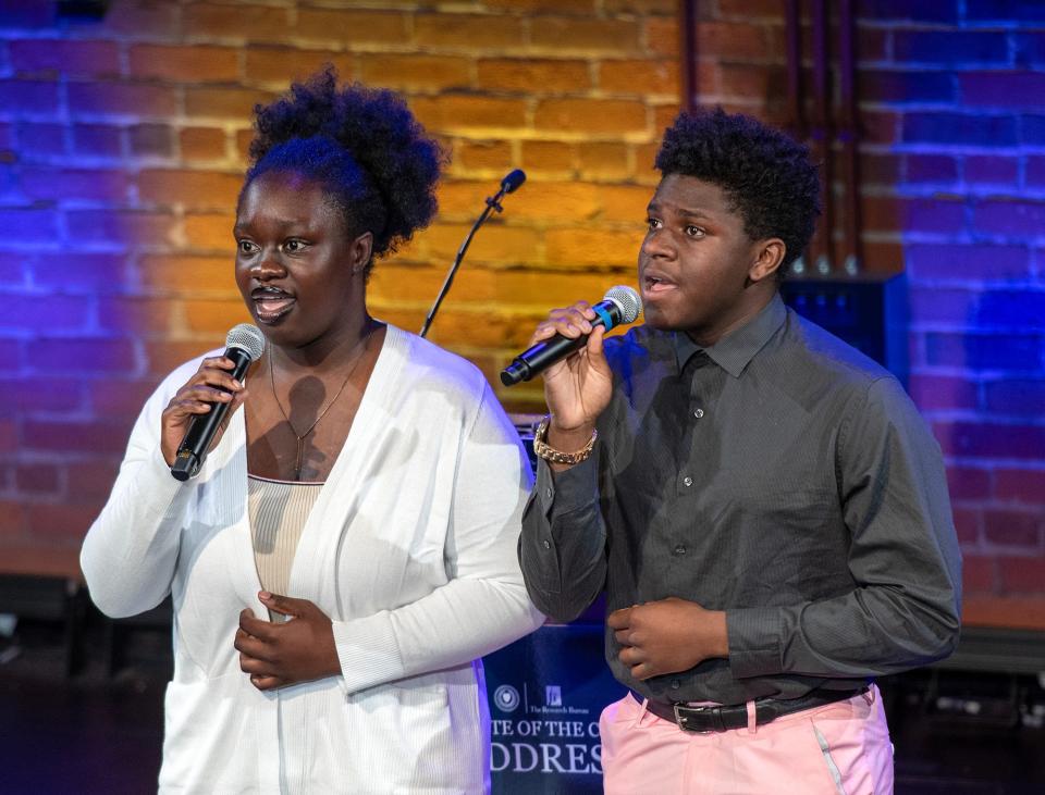 Burncoat High School students Nevaeh Agyeman Duah, left, and Jayden Bordes sing the national anthem before the State of the City address at the Jean McDonough Arts Center Wednesday.