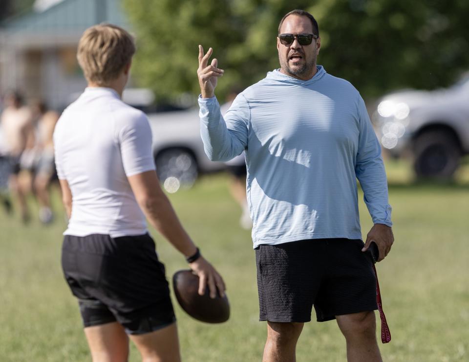 Mike Wilson talks his son Isaac Wilson during a 7-on-7 passing league game in Layton on Friday, June 9, 2023. | Scott G Winterton, Deseret News