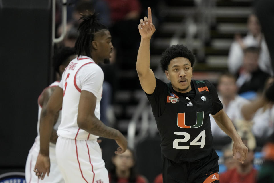 Miami guard Nijel Pack celebrates after scoring against Houston in the first half of a Sweet 16 college basketball game in the Midwest Regional of the NCAA Tournament Friday, March 24, 2023, in Kansas City, Mo. (AP Photo/Charlie Riedel)