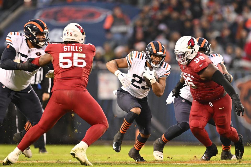 Roschon Johnson #23 of the Chicago Bears rushes with the ball for a first down during the second quarter against the Arizona Cardinals at Soldier Field on Dec. 24, 2023, in Chicago, Illinois.