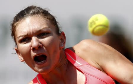 Simona Halep of Romania plays a shot to Mirjana Lucic-Baroni of Croatia during their women's singles match at the French Open tennis tournament at the Roland Garros stadium in Paris, France, May 27, 2015. REUTERS/Vincent Kessler