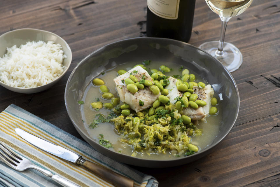 This 2018 photo provided by Katie Workman shows a dish of cod, cabbage and edamame taken in New York. Cabbage, that taken-for-granted vegetable, that sturdy, dense staple of many a poor, ancestral homeland, is finally getting respect. (Cheyenne Cohen/Katie Workman via AP)