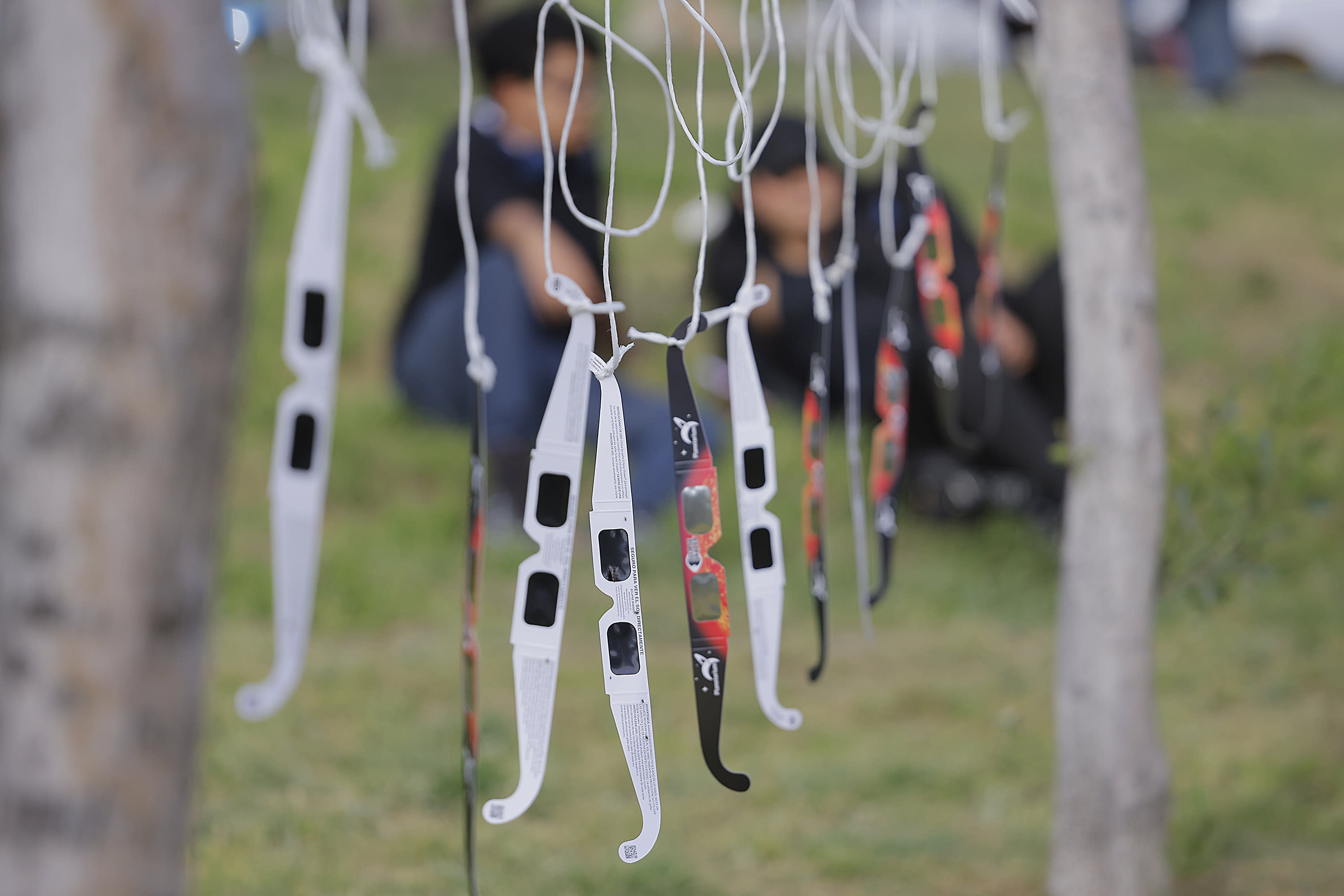 Glasses to see the eclipse in the Bosque Urbano. Millions of people have flocked to areas across North America that are in the 