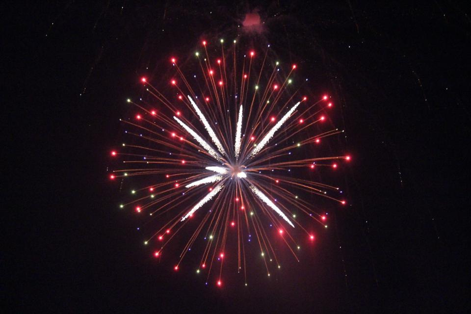 Fireworks light up the sky in Perry's Pattee Park on Monday, July 4, 2022.