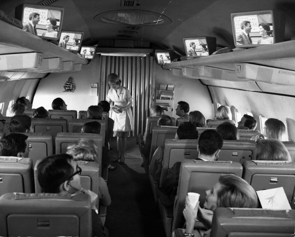 The test flight over Kennedy Airport of a new Pan American Airlines plane, fitted with television sets in the hand luggage racks for the entertainment of passengers.