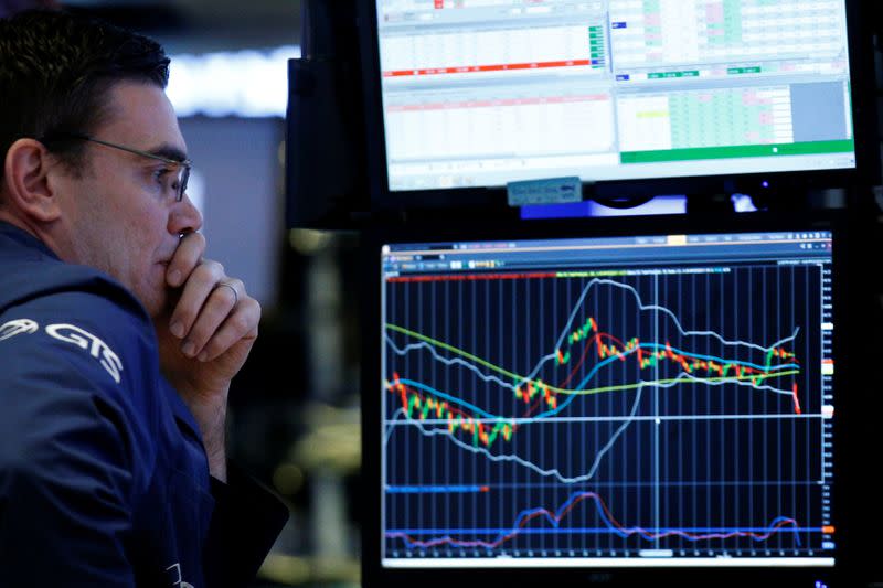 A specialist trader works at his post on the floor of the NYSE in New York