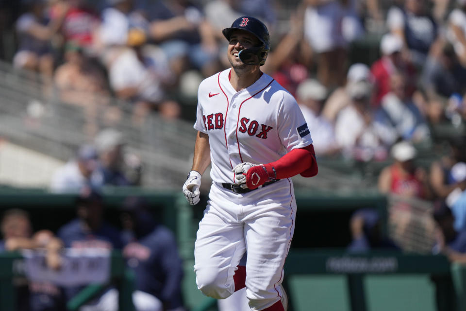 Boston Red Sox Adam Duvall smiles has he runs the bases on his solo homer in the fifth inning inning of a spring training baseball game against the New York Yankees in Fort Myers, Fla., Sunday, March 12, 2023. (AP Photo/Gerald Herbert)