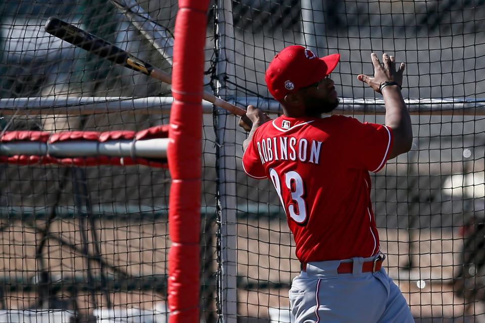 Cincinnati Reds minor league catcher Chuckie Robinson (83) takes batting practice during a midday spring training workout at the Cincinnati Reds Player Development Complex in Goodyear, Ariz., on Saturday, Feb. 27, 2021.