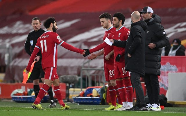 Mohamed Salah (left) appeared unimpressed at being substituted 