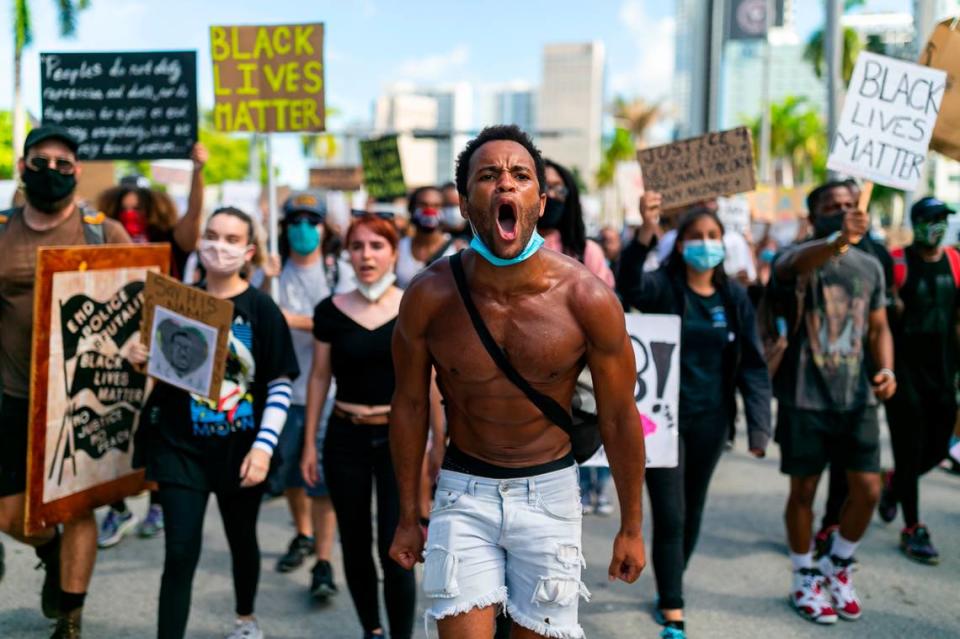 Jonathan Gartrelle, 31, a South Beach resident, leads a group of activists during an anti-racism protest near the Torch of Friendship in downtown Miami, Florida, on Saturday, June 13, 2020.