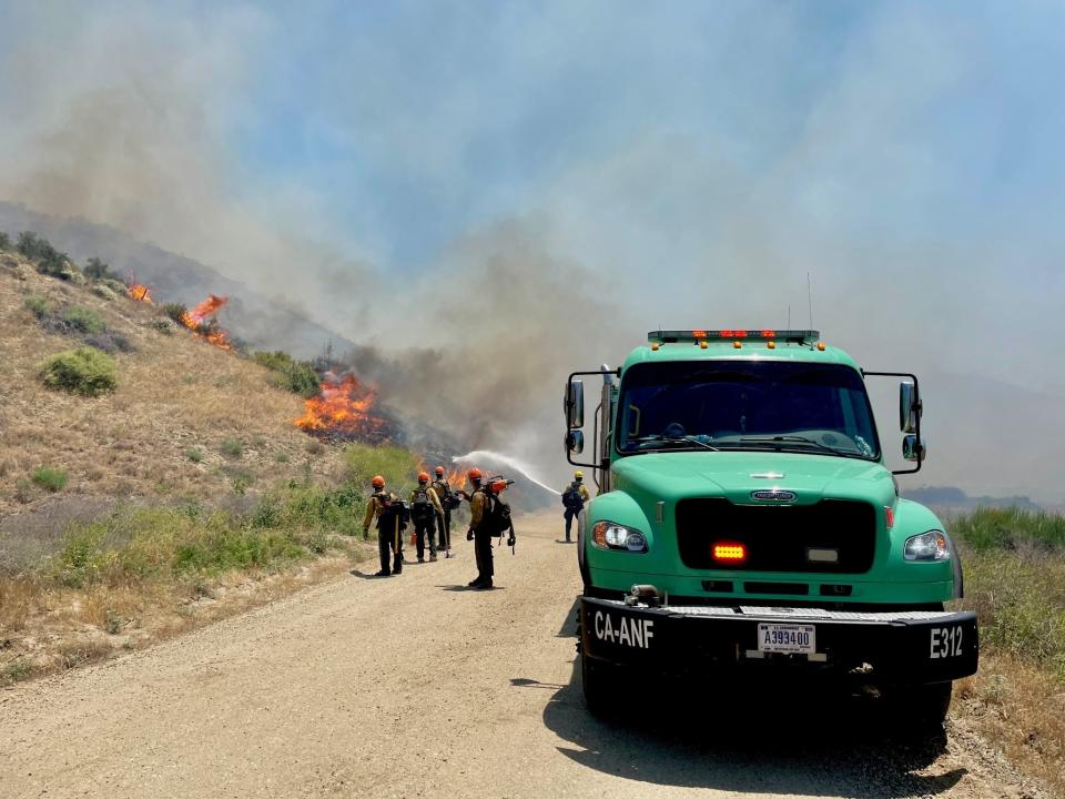 U.S. Forest Service crews from Los Padres National Forest fought flames Sunday on the Post Fire, which started outside Gorman on Saturday.