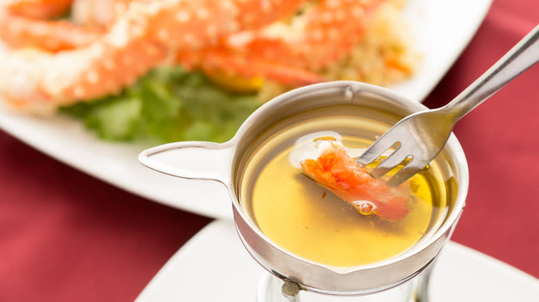 Dipping crab in clarified butter